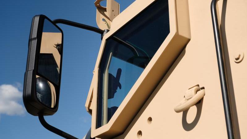 Mack Defense is partnering with XPER, Inc. to provide vehicle accessories for the Mack® Granite®-based M917A3 heavy dump truck like the Spare Tire Carrier and the transparent armor pictured above.