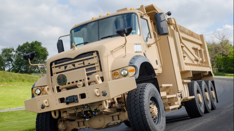 Mack Defense and Phillips & Temro Industries have partnered to offer engine heating systems for the U.S. Army M917A3 Heavy Dump Trucks (left) that significantly improve extreme cold weather startabililty and performance.