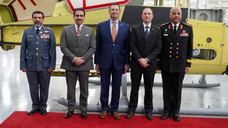 Brigadier General Faisal Al Kaabi, Bahrain Ambassador to U.S. - H.E. Shaikh Abdulla Al Khalifa, Bell Executive Vice President Military Business - Vince Tobin, Bell Vice President and H-1 Program Director - Michael Deslatte, and Bahrain Defense Attaché to U.S. - Commodore Admiral Jasim Al Jowder pose in front of an AH-1Z Viper during an aircraft frame signing ceremony at Bell’s Amarillo assembly center on 31 March 2021.