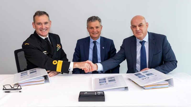  Commodore Charles Huxtable, RAN, Assistant Minister for Defence the Hon Matt Thistlethwaite MP, and Matthew Sibree, CAE Managing Director – Indo-Pacific.