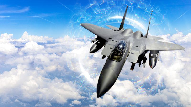 An F-15 flies above the clouds. An artistic overlay portrays electronic warfare capabilities.