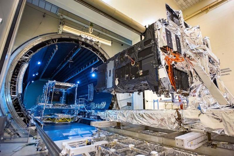 Lockheed Martin's fully-assembled SBIRS GEO 5 missile warning satellite moves into the Thermal Vacuum (TVAC) test chamber. | by Lockheed Martin