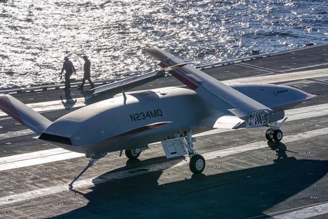 ON THE HOOK: With its tailhook extended to simulate catching the wire during an arrested landing, T1 prepares to taxi clear of the landing area in a safe and timely manner. (Photo: Tim Reinhart/Boeing)