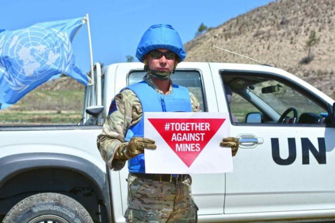 A member of UNMAS training recognise mine threats in the buffer zone. (UNFICYP/Juraj Hladky)