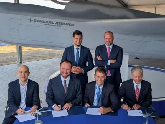 An industrial cooperation MOU was signed on July 22. Seated (left to right): dotOcean CEO Koen Geirnaert, Thales Belgium CEO Alain Quevrin, GA-ASI CEO Linden Blue, and Octave VP in Europe Maximilian Weber. Standing (left to right): Ministre-President de la Wallonie Adrien Dolimont, and Belgium Defence and Foreign Trade Minister Theo Franken.